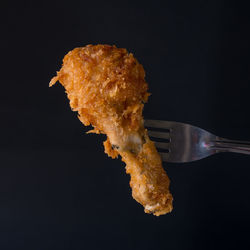 Close-up of bread against black background