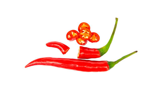 Close-up of red chili pepper against white background