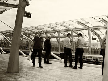 People standing on floor against sky