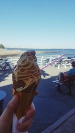 Man holding ice cream cone