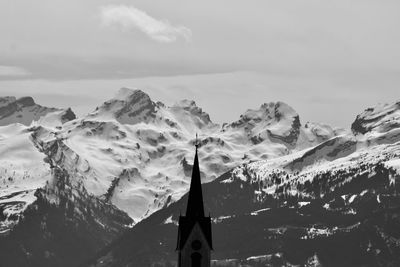 Panoramic view of snowcapped mountains against sky