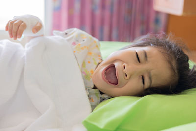 Young woman sleeping on bed at home