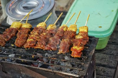 High angle view of meat on barbecue grill