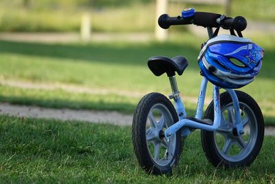 Close-up of bicycle on field