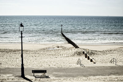 Scenic view of beach against clear sky