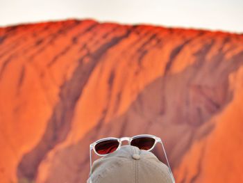 In front of huge red monolith