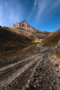 Autumn day on a scenic but difficult 4x4 track located in front of the summit. off-road, wide angle