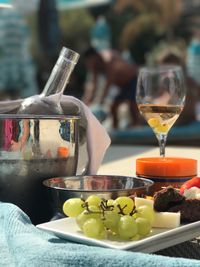 Close-up of wine glasses on table