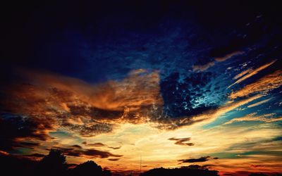 Low angle view of dramatic sky during sunset