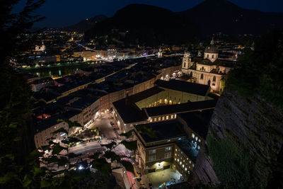 High angle view of illuminated buildings in city