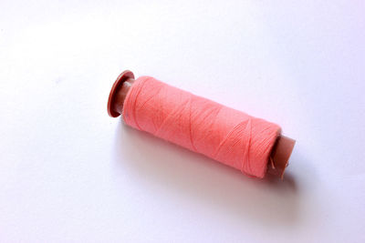 High angle view of colored pencils over white background