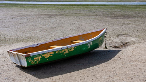 Boat moored on beach