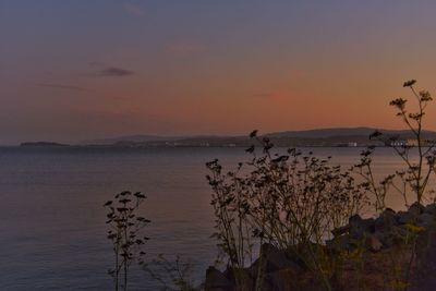 Scenic view of sea against sky at sunset