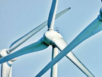 Low angle view of windmill against sky