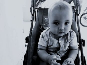 Portrait of cute boy sitting in bus