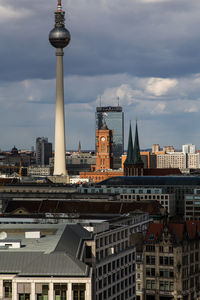 City skyline against cloudy sky