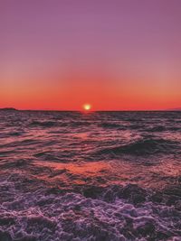 Scenic view of sea against romantic sky at sunset