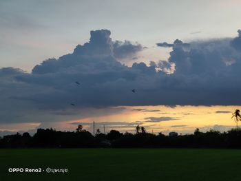 Scenic view of land against sky during sunset