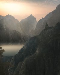 Scenic view of mountains against sky during sunset