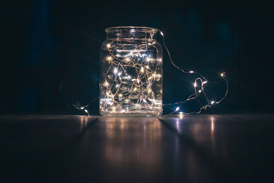 Close-up of glass jar on table