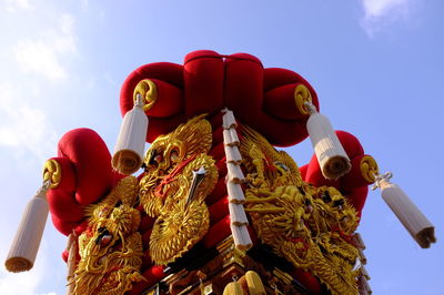 Low angle view of statue against sky