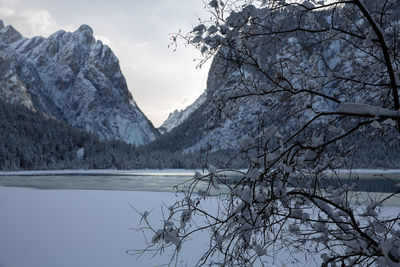 Scenic view of lake against sky during winter