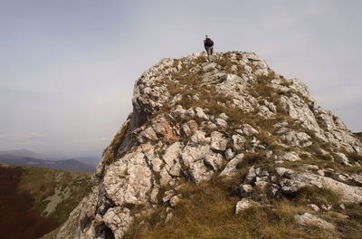 Rock formation on mountain against sky