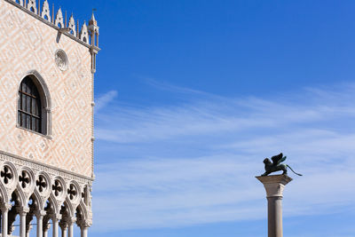 Low angle view of traditional building against blue sky