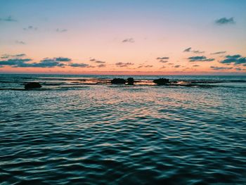 Scenic view of rippled seascape during sunset