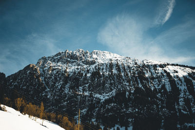 Scenic view of snow covered mountains against sky