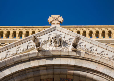 Low angle view of statue against building