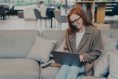 Young woman using laptop