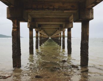 Pier over sea against sky