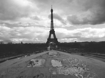 Low angle view of tower against cloudy sky