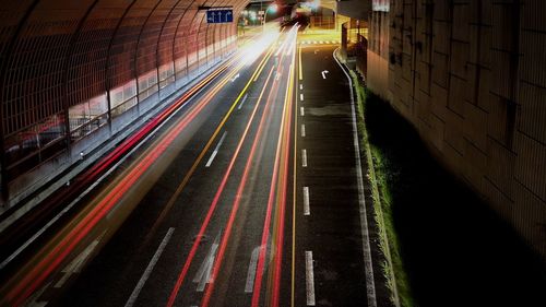 High angle view of light trails on road at night