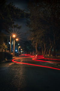 Light trails on city street at night