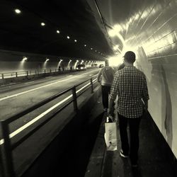 Blurred motion of man on railroad station platform