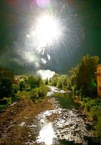 Scenic view of river against sky at night