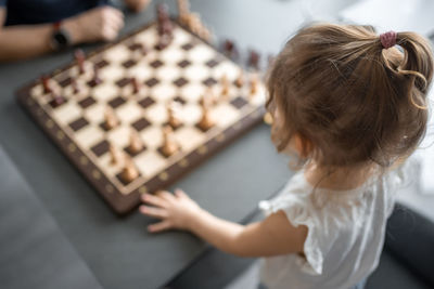 Close-up of girl playing chess