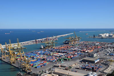 High angle view of harbor against clear blue sky. port of barcelona.