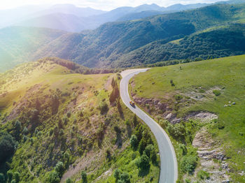 High angle view of road amidst mountains