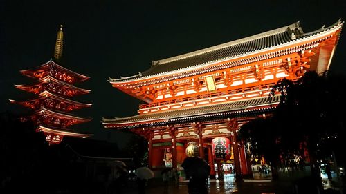 Low angle view of illuminated building at night