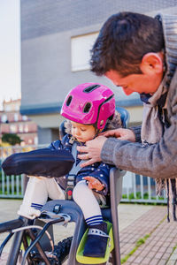 Mother and son riding bicycle
