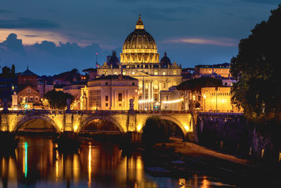 Ponte sant angelo over tiber river in city at night