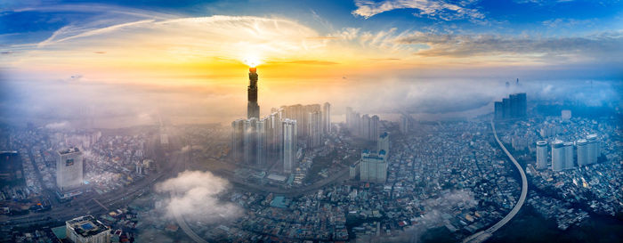 High angle view of city at sunset