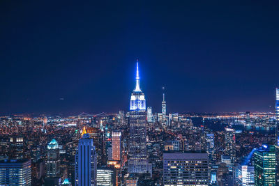 Illuminated buildings in city at night