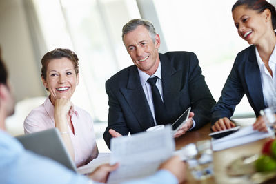 Business colleagues talking at office