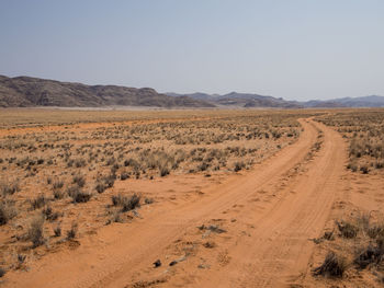 Scenic view of desert against clear sky