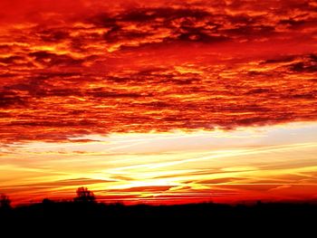 Scenic view of dramatic sky over sea during sunset