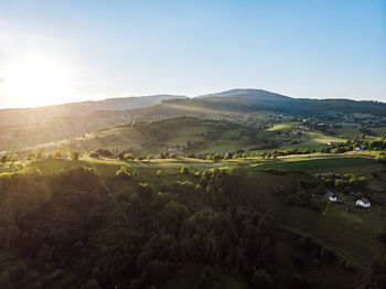 Sun shining over green mountain